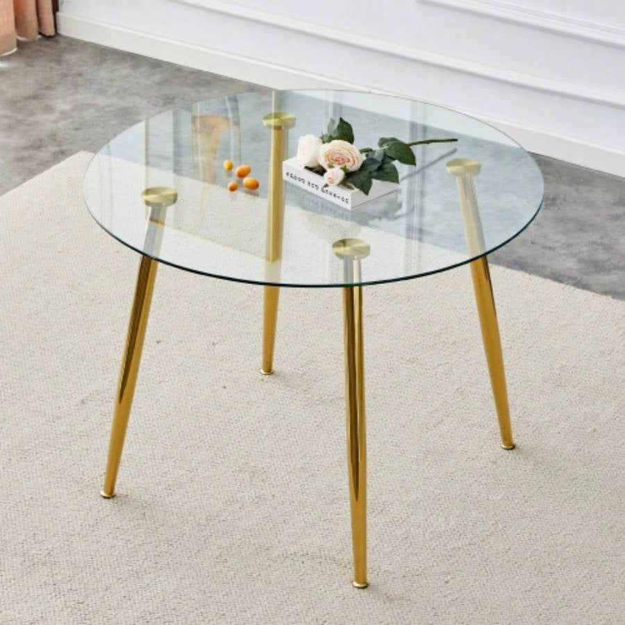 A glass tabletop with a diameter of 38.6 inches and a modern minimalist circular dining table with silver metal. Suitable living rooms, and conference rooms.
