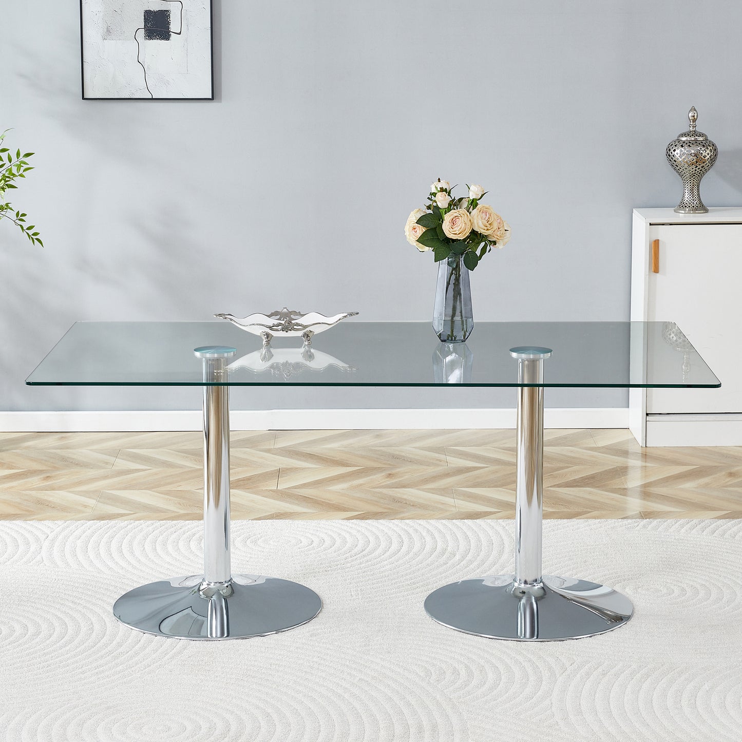 A glass tabletop with 71*35.4 inches and a modern minimalist circular dining table with electroplated silver metal legs. Suitable for restaurants, living rooms.