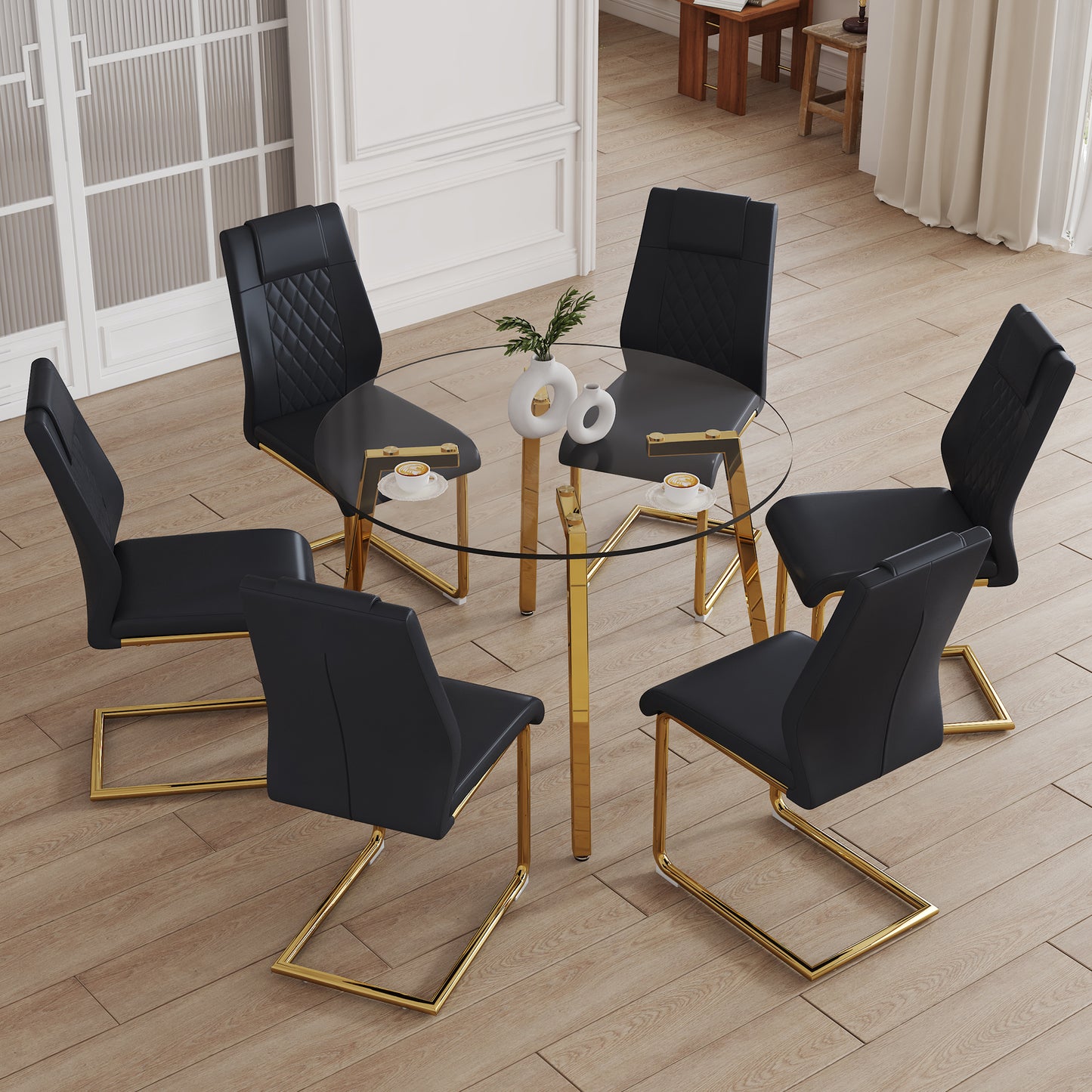 Table and chair set.A Modern Minimalist Style Round Clear Tempered Glass Table with Metal Legs.Paried with black chairs with Modern PU Leather High Back Upholstered and C-Tube Golden Legs.