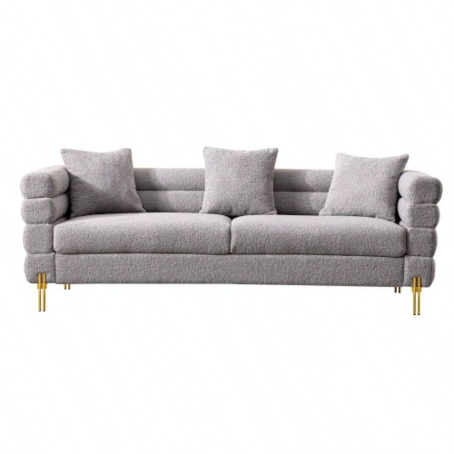 Luxurious and comfortable upholstered sofa with golden and pillows living room and reception area
