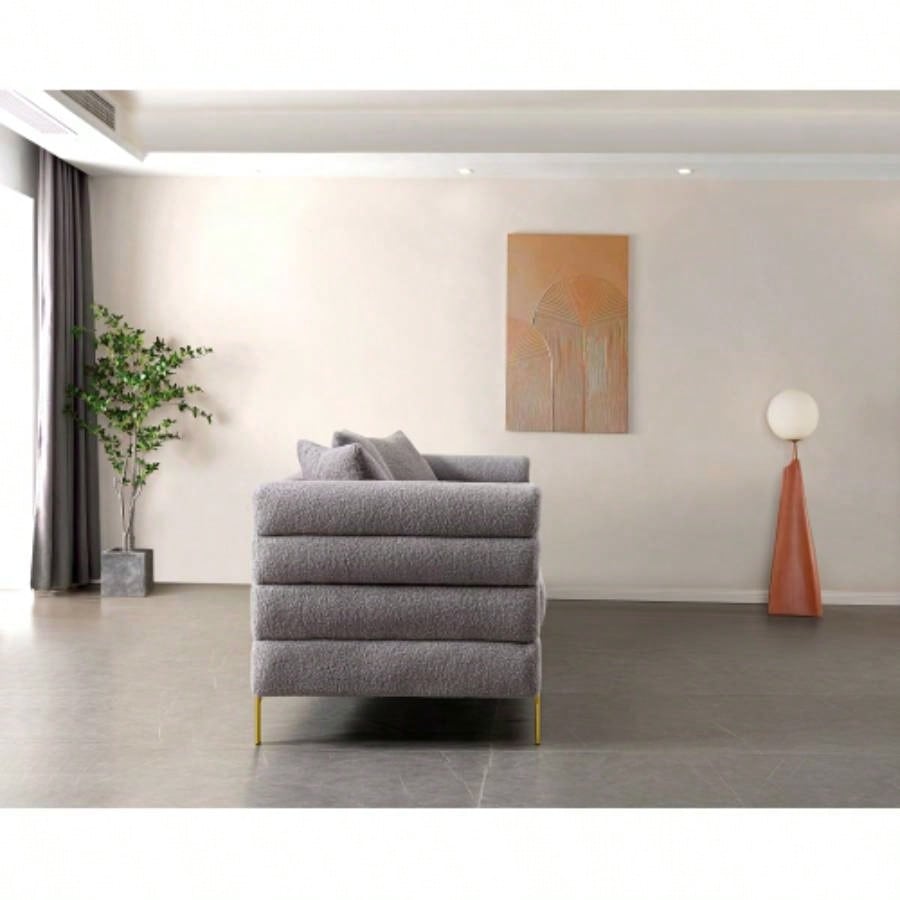 Luxurious and comfortable upholstered sofa with golden and pillows living room and reception area