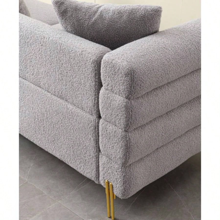 Luxurious and comfortable upholstered sofa with golden and pillows living room and reception area