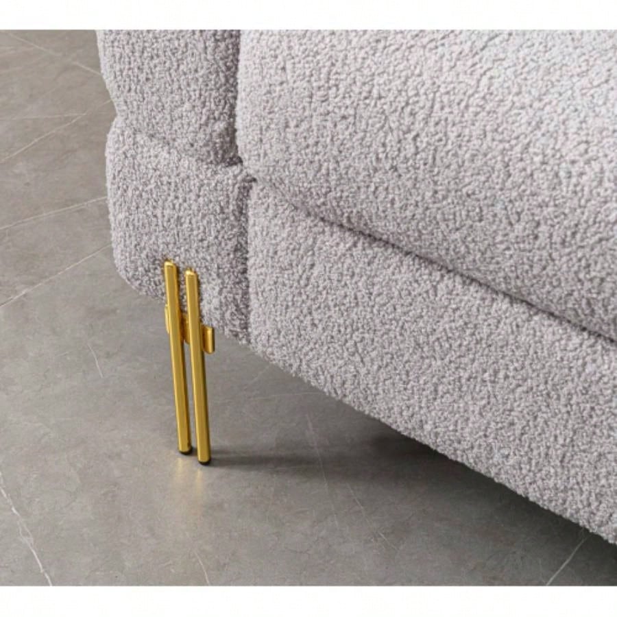 Luxurious and comfortable upholstered sofa with golden and pillows living room and reception area