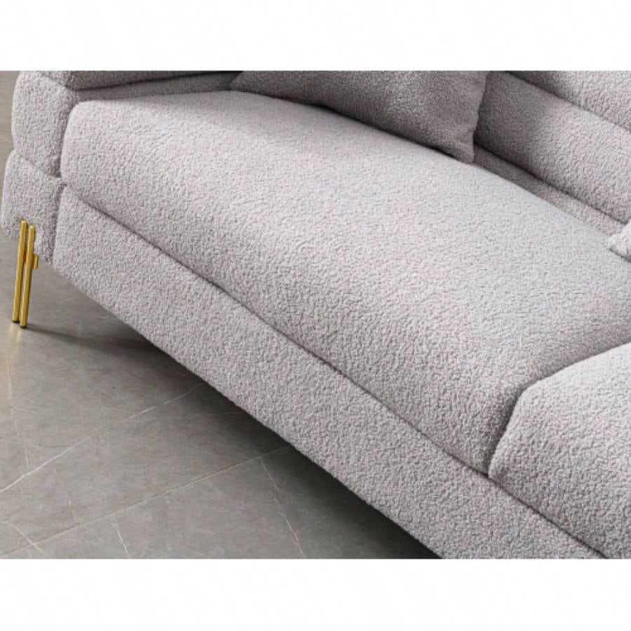 Luxurious and comfortable upholstered sofa with golden and pillows living room and reception area