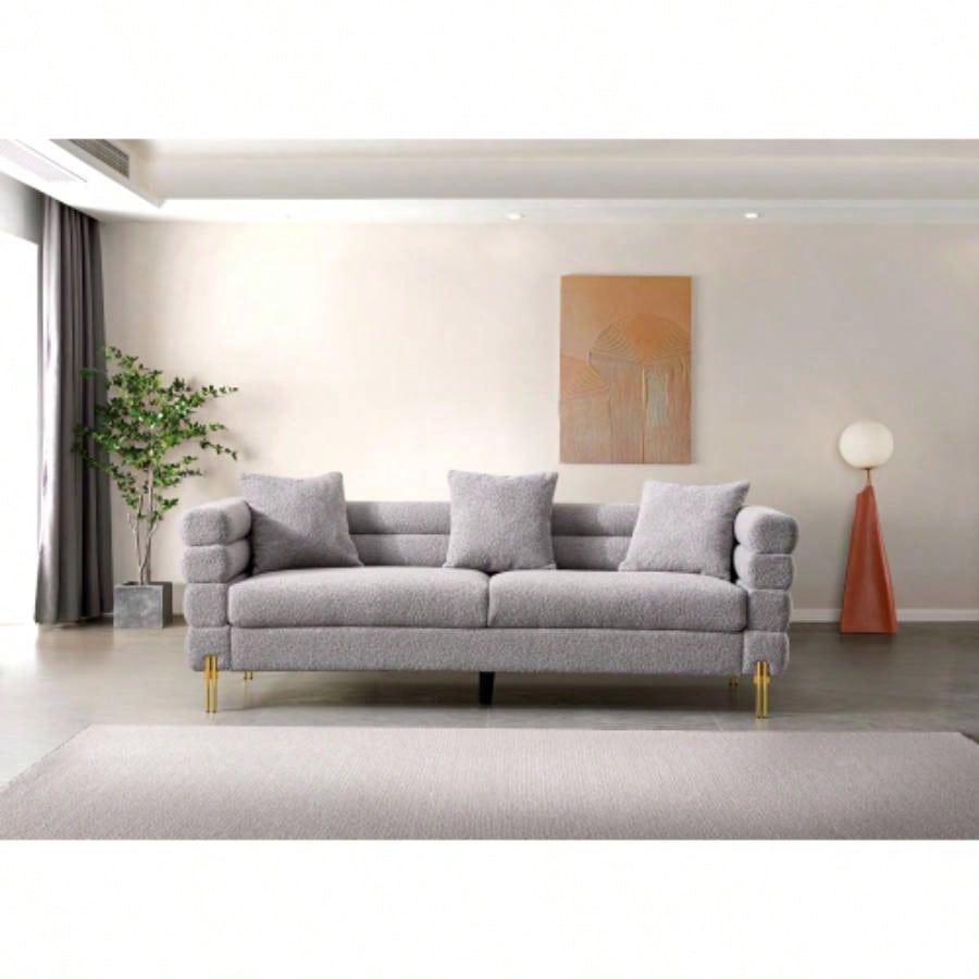 Luxurious and comfortable upholstered sofa with golden and pillows living room and reception area