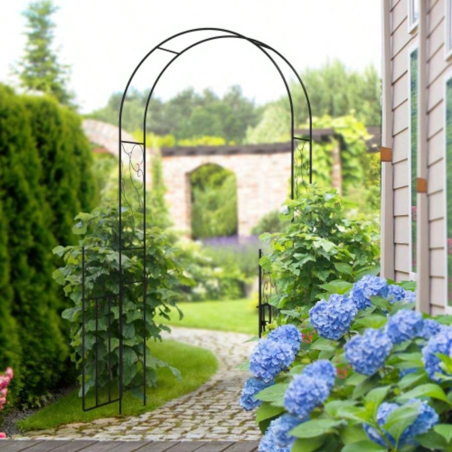 Outsunny. 5 Metal Garden Arch with Gate, Garden Arbor Trellis Climbing Plants, Roses, Vines, Wedding Arch Outdoor Garden, Lawn, Backyard, Black