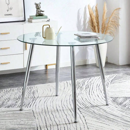 A glass tabletop with a diameter of 38.6 inches and a modern minimalist circular dining table with silver metal. Suitable living rooms, and conference rooms.