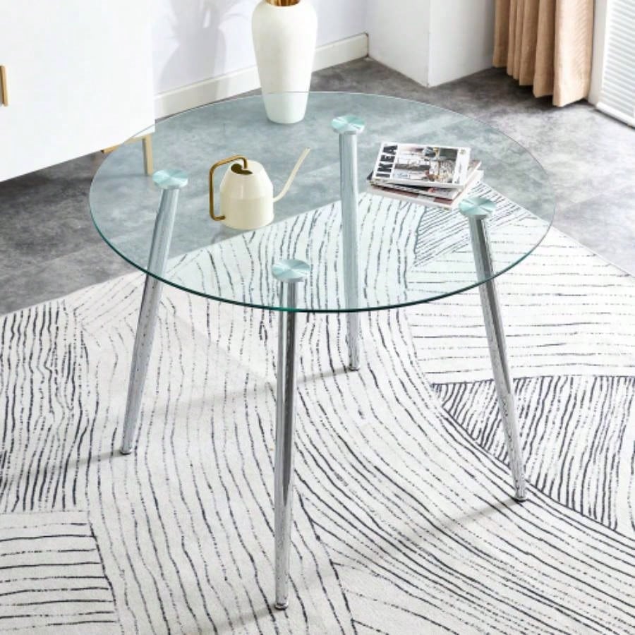 A glass tabletop with a diameter of 38.6 inches and a modern minimalist circular dining table with silver metal. Suitable living rooms, and conference rooms.