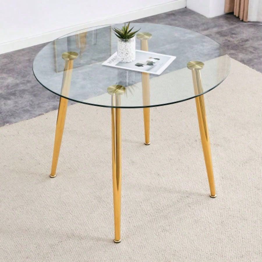 A glass tabletop with a diameter of 38.6 inches and a modern minimalist circular dining table with silver metal. Suitable living rooms, and conference rooms.
