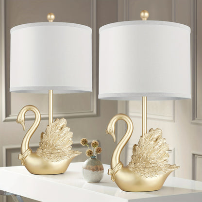 Two-piece Set of Table Lamps: Golden Brass Swan Table Lamps with LED Bulbs. These modern-designed, stylish table lamps are a perfect fit for the decor of any contemporary bedroom or living room, and a