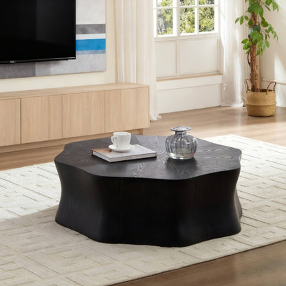 Black petal coffee table, with fiberglass surface covered with birch wood grain veneer in watercolor finish and sprayed with black paint. The sides have a brushed effect. Suitable for living room.