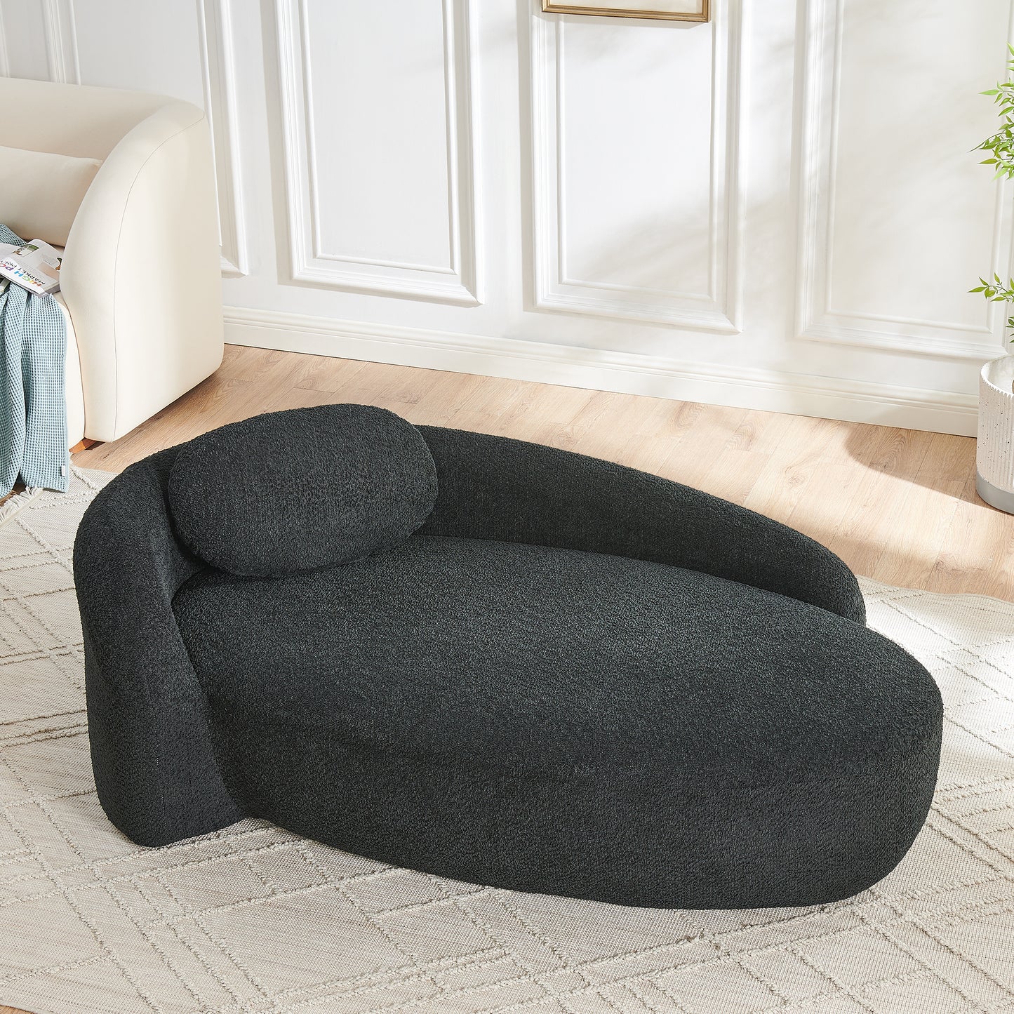 Black Foam Oval Lounge Chair with Pillow for Cozy Living Room Comfort