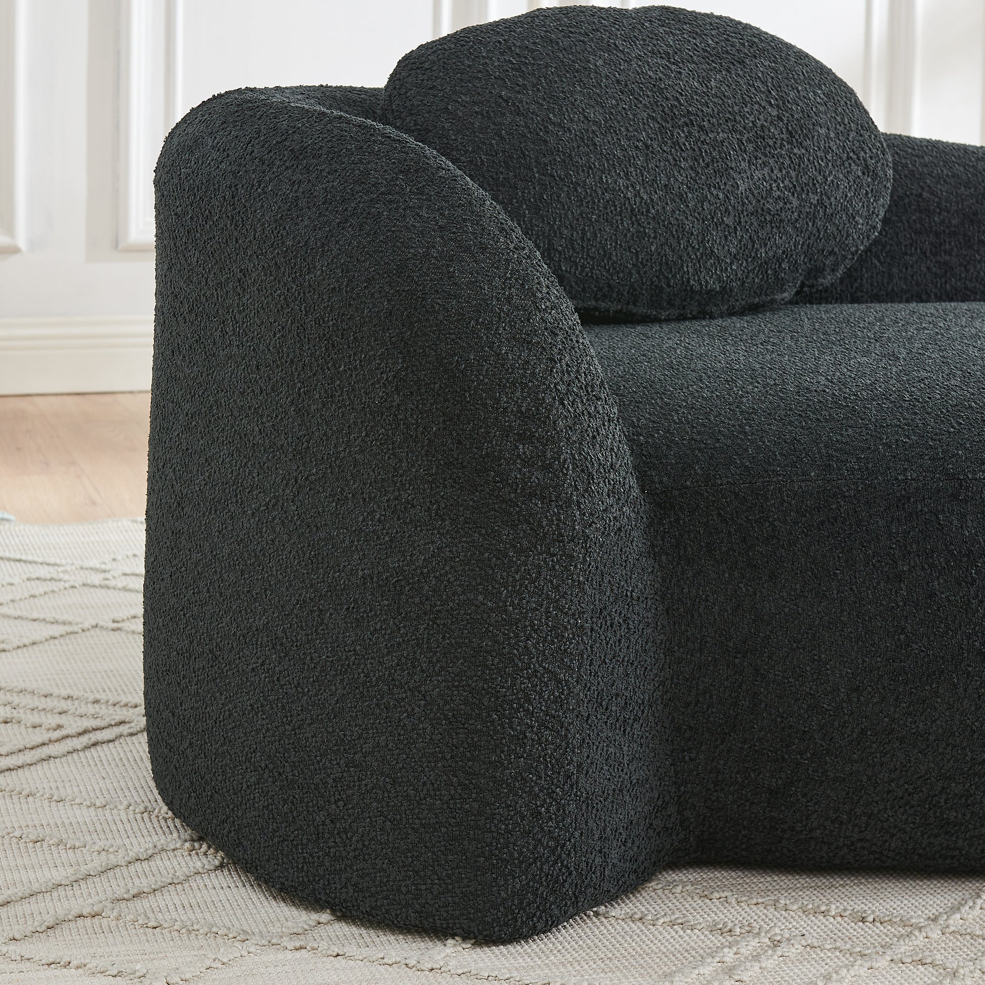 Black Foam Oval Lounge Chair with Pillow for Cozy Living Room Comfort