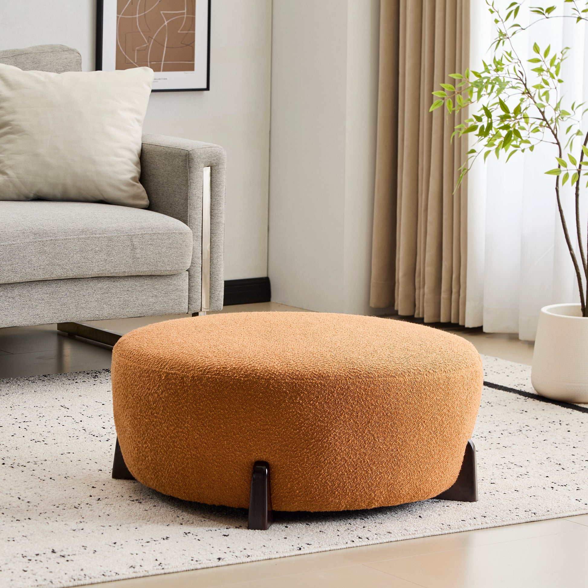 Modish Round Ottoman: Boucle Top with Splayed Rubber Wood Legs, Pumpkin Orange