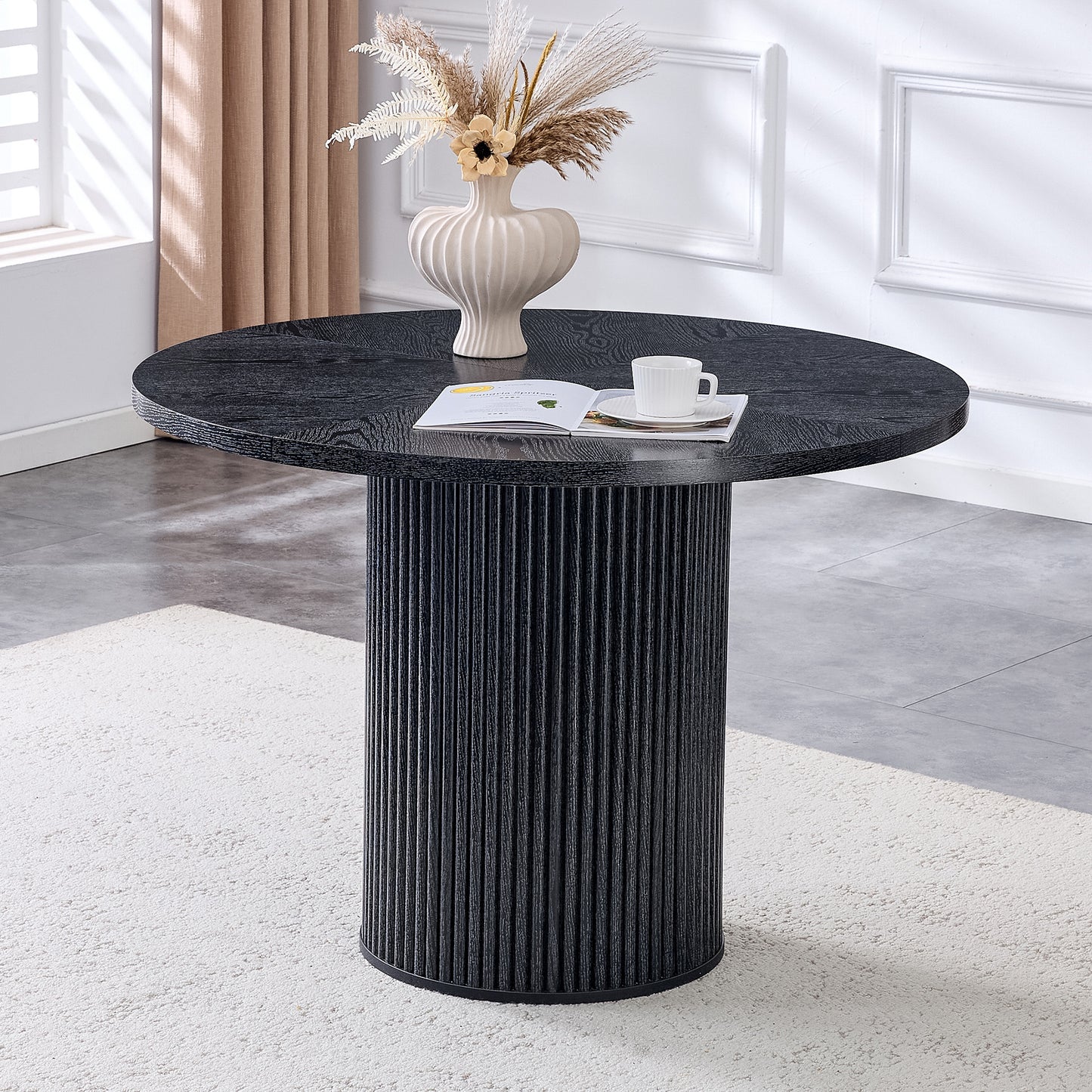 A modern spliced circular dining table with a diameter of 42 inches, featuring black wood color textures fan-shaped diagonal color splicing board design, interpreting home aesthetics and practicality.