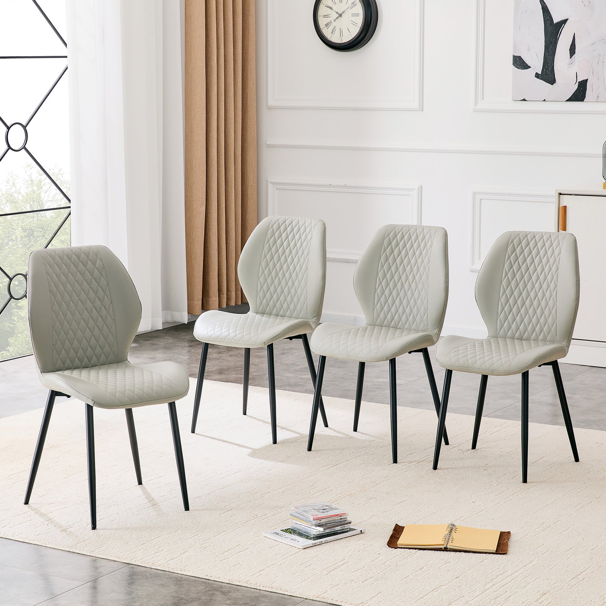 Set of 4 modern light luxury light gray diamond-quilted PU chairs with black metal legs. Suitable as upholstered dining chairs with backrests for dining rooms, adaptable to a wide range of scenarios.