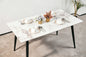 Modern Minimalist Dining Table(1.4M) with White Sintered Stone Top and Sleek Black Tapered Metal Legs for a Contemporary Kitchen or Dining Room