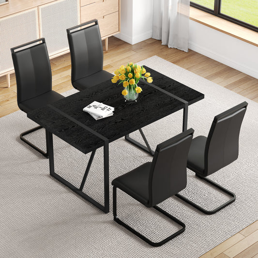 Black Faux Wood Grain MDF Dining Table Set.A minimalist retro rectangular dining table with a black textured top.Paired with 4 Black PU chairs with Black Featuring arched black legs.