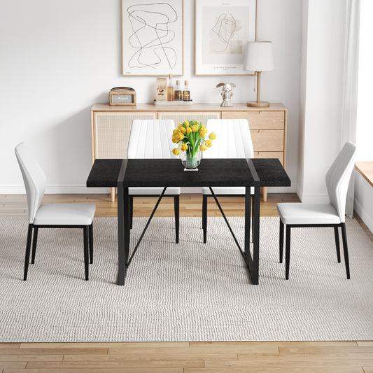 Black Faux Wood Grain MDF Dining Table Set.A minimalist retro rectangular dining table with a black textured top.Paired with 4 Black - and - White PU Dining Chairs with Shell - pattern.