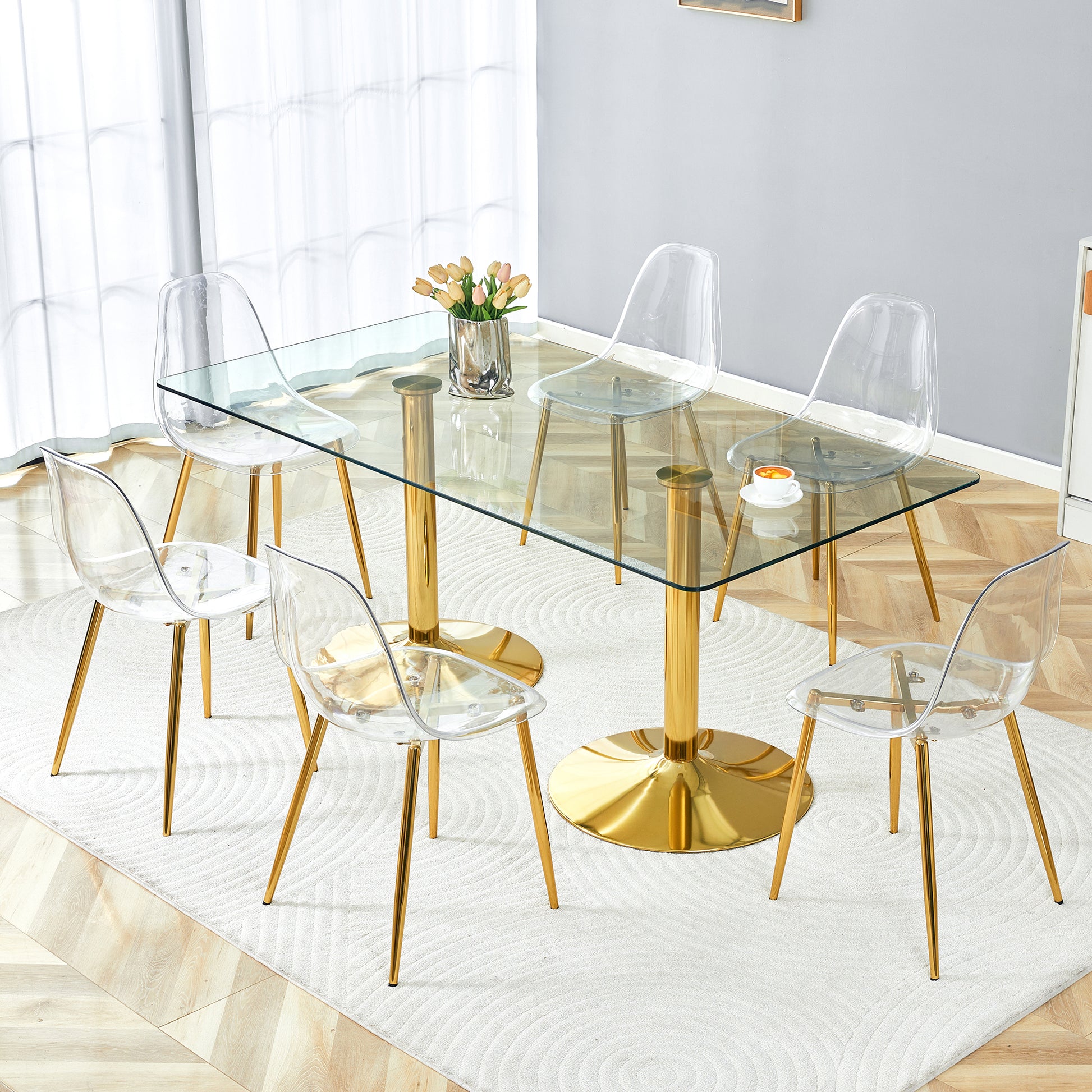 Table and chair set.71 inch x 35.4-inch tempered glass table,Paired with 6 Transparent Plastic Chairs with Golden Metal Legs.Bring a comfortable home experience.