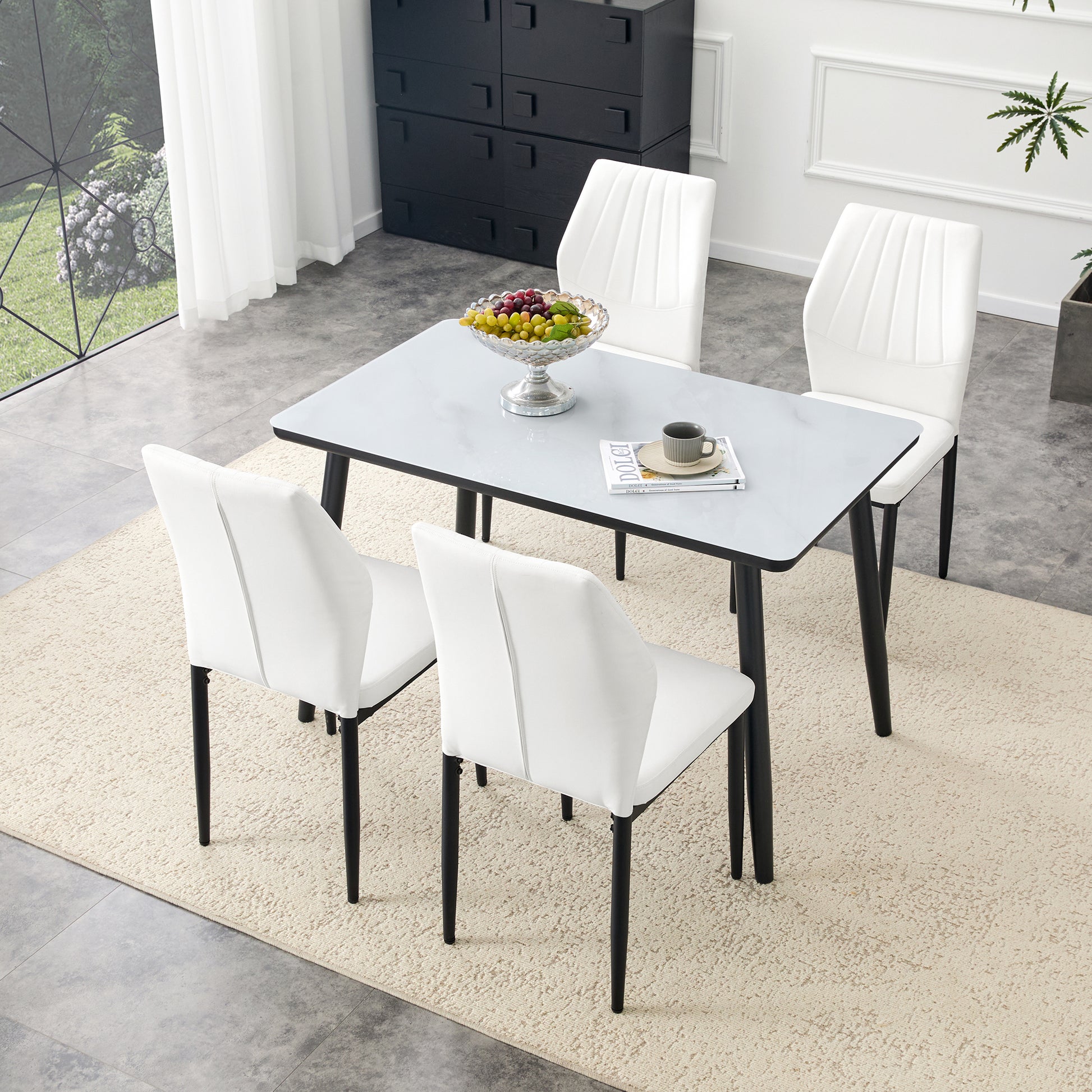 Table and Chair Set.Modern dining table. White imitation marble texture glass top + lower black MDF board,black metal legs.Paired with 4 White Dining Chairs, 37 inches High, Ergonomic PU Backrest.