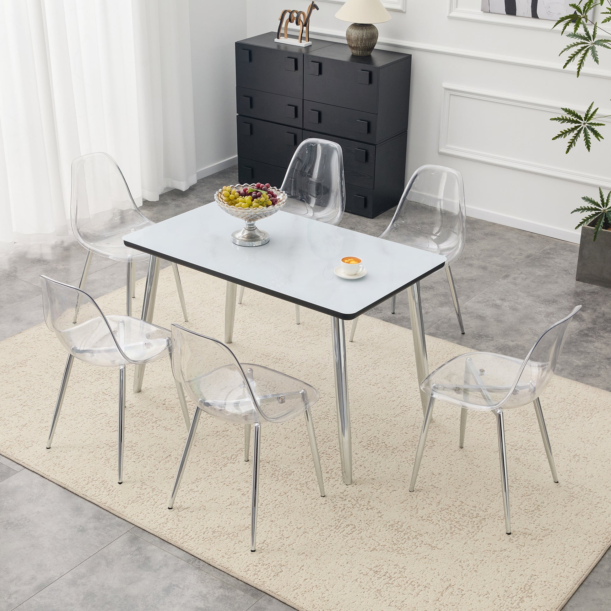 Table and chair set.Table and chair set.White imitation marble texture glass top + lower black MDF board,silver metal tapered legs.Paired with 6 Transparent Plastic Chairs with Silver Metal Legs.