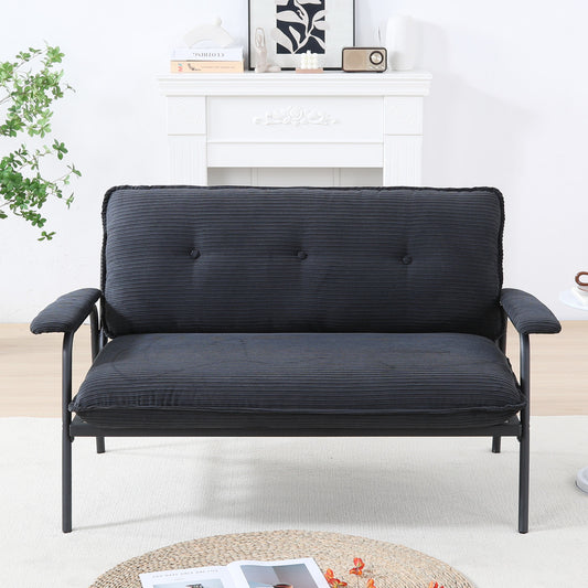 The 53-inch black sofa offers a spacious layout in the small apartment, easily handling various scenarios from watching movies to working
