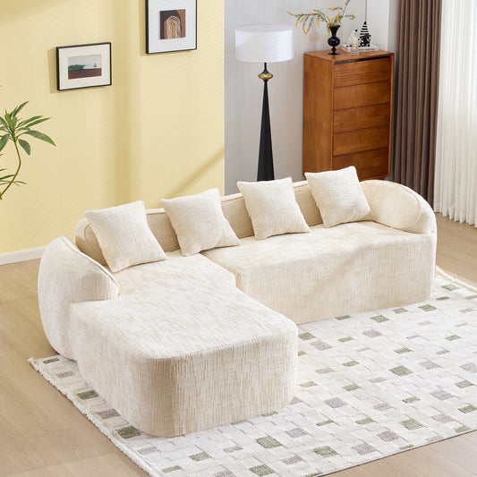 Beige chenille L-shaped compressed sofa that goes well with any living room. It features high-elastic sponge for a comfortable sitting feel,  curved armrests and four throw pillows.